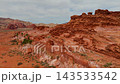 Aerial Little Finland Red Sandstone Formations and Desert Vegetation Fly Through 143533542