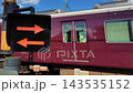 Hankyu train passing through a level crossing 143535152