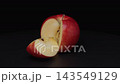 A cropped red apple rotating against a black background. 143549129