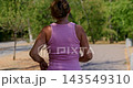 Woman Jogging Outdoors on a Sunny Day 143549310