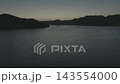 Aerial footage of the sea and islands at sunset in Mihara. 143554000
