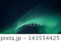 Aurora borealis ribbons moving across starry night sky with green and teal luminous curtains, sweeping flowing bands and soft cloudlike textures creating tranquil celestial panorama 143554425