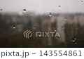Rain Drops Running Down a Window on a Gloomy Autumn Day 143554861