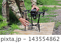 Ukrainian Serviceman Preparing a Military Drone for Launch During Wartime 143554862