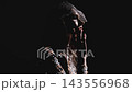 Mysterious woman in sparkling rhinestone veil surrounded by smoke 143556968
