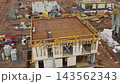 A construction site features a concrete slab framework with visible rebar being prepared for pouring at a building. 143562343
