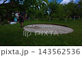 Preparation and leveling of the ground for a pool in the backyard during summer 143562536