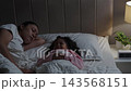 mother and daughter sleeping together and sweet dream in a bed at night  143568151