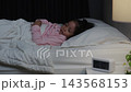 preschool child girl sleeping on a bed at night 143568153