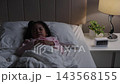 preschool child girl sleeping on a bed at night 143568155