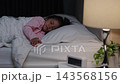 preschool child girl sleeping on a bed at night 143568156