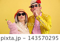 Stylish senior couple eating lollipops and having fun 143570295