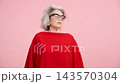 Stylish senior woman with grey hair dancing 143570304