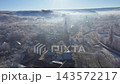 Morning sunrise lights and mist, fog over village church tower aerial drone view 143572217
