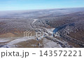 Flying over frosty winter hills and forest 143572221