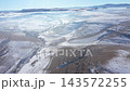 Aerial view of misty countryside hills at wintertime, morning fog above by drone 143572255