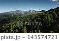 Aerial view over green mountain forests and peaks. parallax effect 143574721