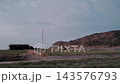 Peaceful Countryside and Volcanic Cone View from Moving Car Window in Jeju Island 143576793