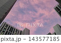 Tilt Up View of Pink Sunset Sky and High Rise Apartment Buildings at Dusk 143577185