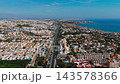 Aerial view coastal resort town and highway 143578366