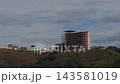 Unfinished Concrete Building on Hillside Under Cloudy Sky 143581019