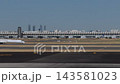Commercial Airplane Taxiing Across Madrid Airport Runway Area 143581023