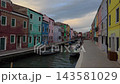 Quiet Venetian Canal With Moored Boats Under Gray Sky 143581029