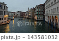 Quiet Venetian Canal at Night with Gondolas and Reflections 143581032