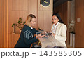 Elegant check-in at a modern hotel with friendly staff 143585305