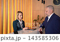 Meeting at the reception desk with an Asian woman during a hotel check-in process 143585306
