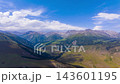 dolly forward aerial hyperlapse of clouds moving above green mountains in Kyrgyzstan 143601195