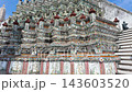 BANGKOK, THAILAND - 6th OCTOBER 2024: Close clip tilting up Thonburi Pagoda of Wat Arun in Bangkok Thailand on a sunny morning 143603520