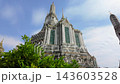 BANGKOK, THAILAND - 6th OCTOBER 2024: Camera tracks around the Thonburi Pagoda of Wat Arun in Bangkok Thailand on a sunny morning 143603528