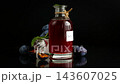 Red plum syrup and ripe fruit against elegant black background 143607025