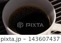 Pouring coffee slow motion footage. Close up white coffee cup. It captures pouring fresh coffee followed by hot water or milk. Create hot Americano Cappuccino or latte coffee. Fresh brew cafe concept 143607437