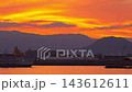 [Time-lapse night view] A picturesque orange sunset, harbor, and ferry 143612611