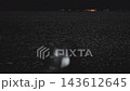 [Quiet Night View of Copy Space on a Full Moon Night] A Japanese Night View with the Sea Surface and Guide Lights 143612645