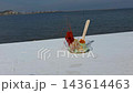 Gourmet dish featuring red Denia prawn with salmon caviar and green sauce in front of the Mediterranean Sea at Gastronomic Festival in Denia Spain. 143614463
