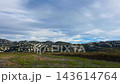 Timelapse of clouds moving over Segaria mountain and Pego Oliva rice fields with dramatic shadows and light playing over the landscape and rustic village. 143614764
