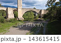Medieval stone bridge of Besalu in La Garrotxa Girona Catalonia Spain Medieval stone bridge of Besalu in La Garrotxa Girona Catalonia Spain 143615415
