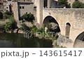Medieval stone bridge of Besalu in La Garrotxa Girona Catalonia Spain Medieval stone bridge of Besalu in La Garrotxa Girona Catalonia Spain 143615417