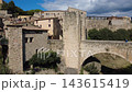 Medieval stone bridge of Besalu in La Garrotxa Girona Catalonia Spain Medieval stone bridge of Besalu in La Garrotxa Girona Catalonia Spain 143615419