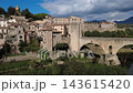 Medieval stone bridge of Besalu in La Garrotxa Girona Catalonia Spain Medieval stone bridge of Besalu in La Garrotxa Girona Catalonia Spain 143615420