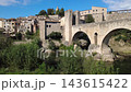 Medieval stone bridge of Besalu in La Garrotxa Girona Catalonia Spain Medieval stone bridge of Besalu in La Garrotxa Girona Catalonia Spain 143615422