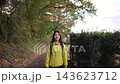 Slow-motion tracking shot of a female hiker walking in the Shibusawa Hills 143623712