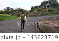 Tracking shot of a female hiker heading towards Shibusawa Hills 143623719