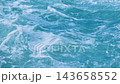 Turquoise ocean water with swirling waves and white sea foam in continuous natural motion. 143658552