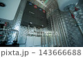 Modern mechanical room interior showing a complex HVAC system with heat pump 143666688