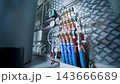 Modern mechanical room interior showing a complex HVAC system with heat pump 143666689