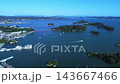 Aerial footage captures the beautiful scenery of Matsushima, one of Japan's three most scenic spots, including the islands floating in the bay, sightseeing boats, and the red bridge, showcasing Miyagi's famous tourist attractions. 143667466